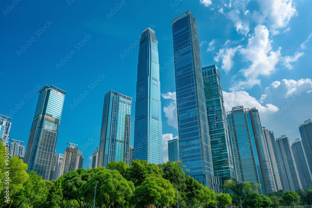 Skyscrapers Reaching into a Bright Blue Sky with White Clouds on a Sunny Day Skyscrapers Reaching into a Bright Blue Sky with White Clouds on a Sunny Day