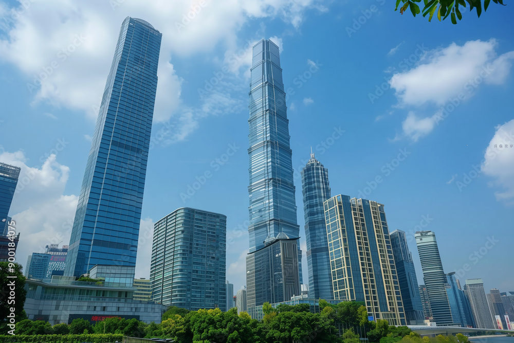 Skyscrapers Reaching into a Bright Blue Sky with White Clouds on a Sunny Day Skyscrapers Reaching into a Bright Blue Sky with White Clouds on a Sunny Day