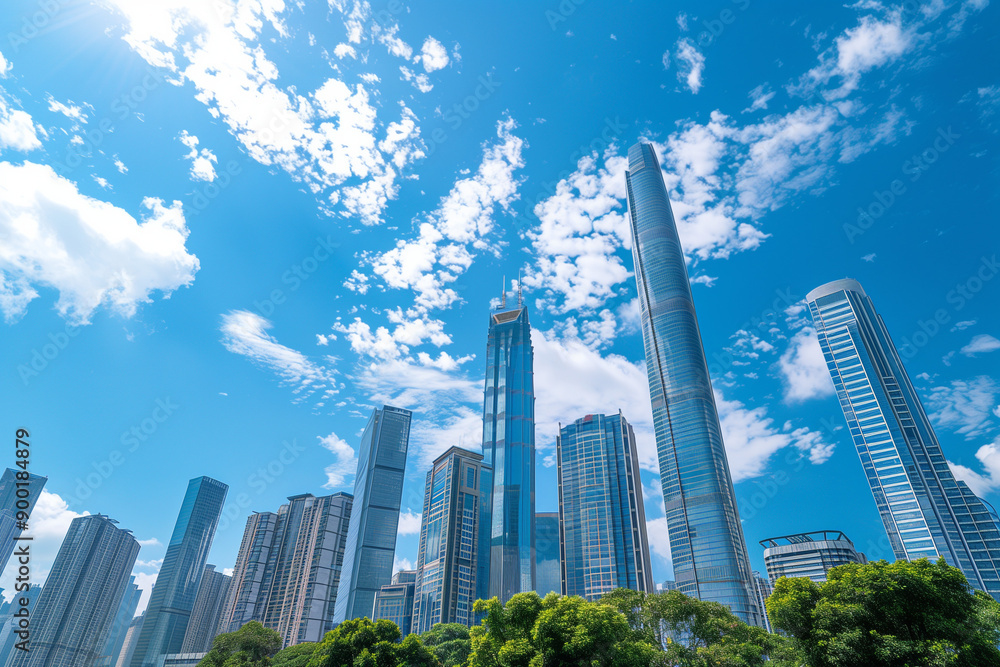 Skyscrapers Reaching into a Bright Blue Sky with White Clouds on a Sunny Day Skyscrapers Reaching into a Bright Blue Sky with White Clouds on a Sunny Day