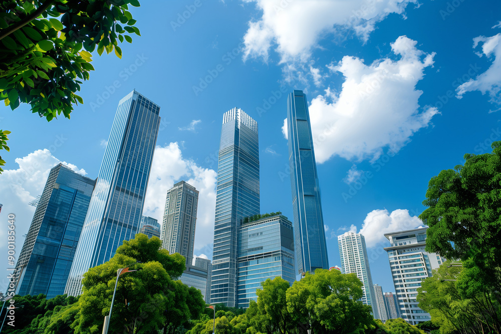 Skyscrapers Reaching into a Bright Blue Sky with White Clouds on a Sunny Day Skyscrapers Reaching into a Bright Blue Sky with White Clouds on a Sunny Day