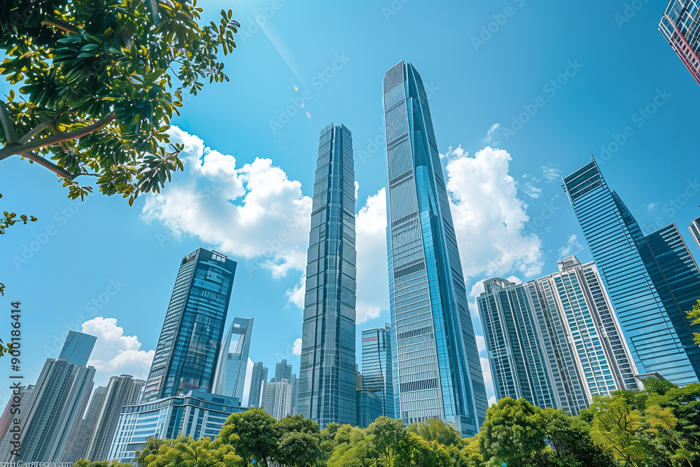 Skyscrapers Reaching into a Bright Blue Sky with White Clouds on a Sunny Day
