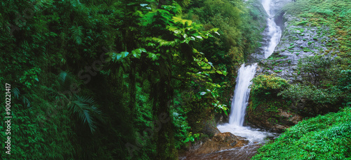 Travel the highest waterfall in Chiangmai Mae-pan waterfall rainy season forest at Doi intanon. background waterfall. photo