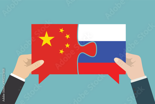 Geopolitics, bilateral political relations and cooperation between Russia and China. Business people hands connect puzzle pieces with flags after deal.
