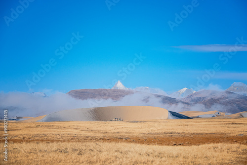 The sand dune of Zhongba, Tibet with the Himalaya mountain photo