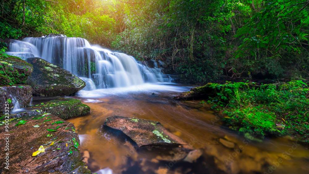Obraz premium Beauty in nature, amazing waterfall in tropical forest of national park, Thailand