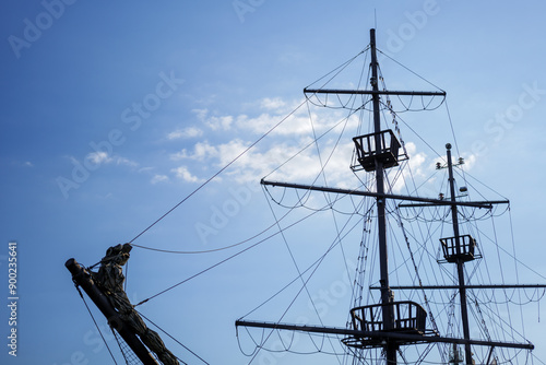 Obraz na płótnie Silhouette of a pirate ship against the blue sky. Three observation points (stork nests).Copy space w salonie