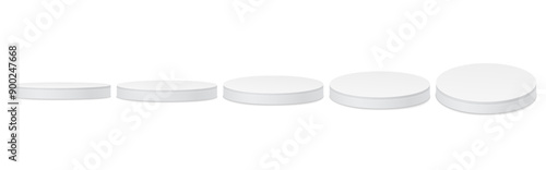 Set of white round empty podiums. Exhibition stand, podium, stage, pedestal. Platforms for product presentation.