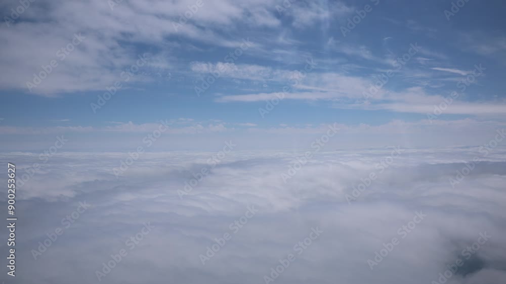 Aerial View Beauty white clouds on blue sky with soft sun light, Nature view fluffy clouds on pastel blue sky background Aerial View Beauty white clouds on blue sky with soft sun light, Nature view fluffy clouds on pastel blue sky background