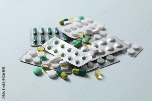 Pills in blisters on a colored background