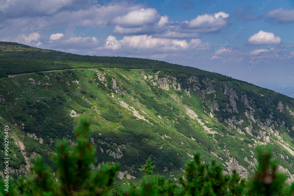 Mountain landscape, mountains in summer. view of the green mountain slopes, rocks on a beautiful summer day. mountain trail leading to the peak. top of the mountain Mountain landscape, mountains in summer. view of the green mountain slopes, rocks on a beautiful summer day. mountain trail leading to the peak. top of the mountain