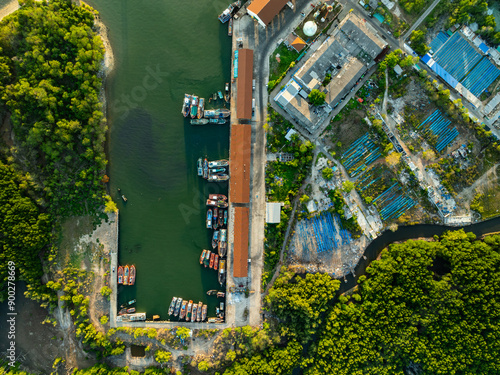 High angle view fisherman boats at the jetty located in Phuket Thailand, aerial view drone top down view,Siray fishing port Phuket Thailand photo