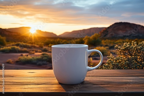 A serene morning scene featuring a white mug on a wooden table with a stunning desert sunrise in the background.