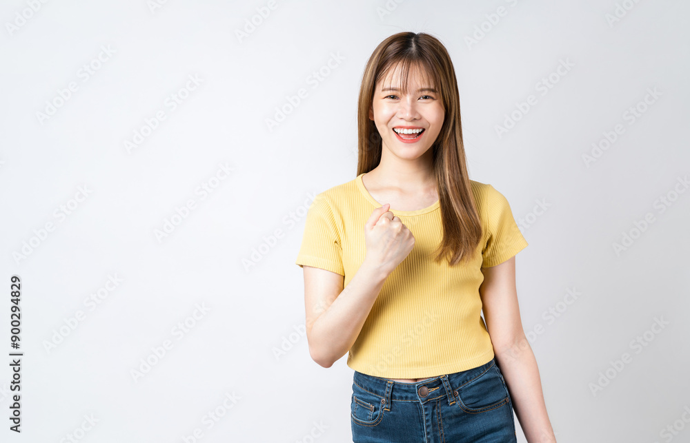 Beautiful Asian woman raises arms and fists clenched with shows strong powerful, celebrating victory expressing success. Beautiful Asian woman raises arms and fists clenched with shows strong powerful, celebrating victory expressing success.