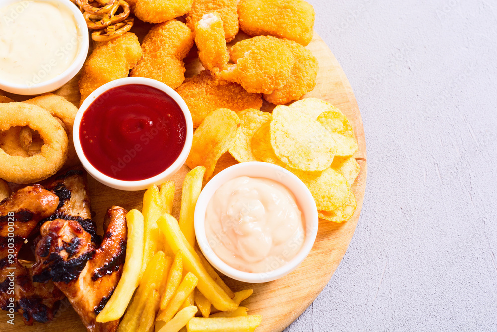 Φωτογραφία Onion rings , nuggets grilled wings , french fries mix of snacks and sauces