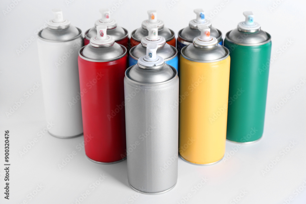 Cans of spray paint on white background Cans of spray paint on white background