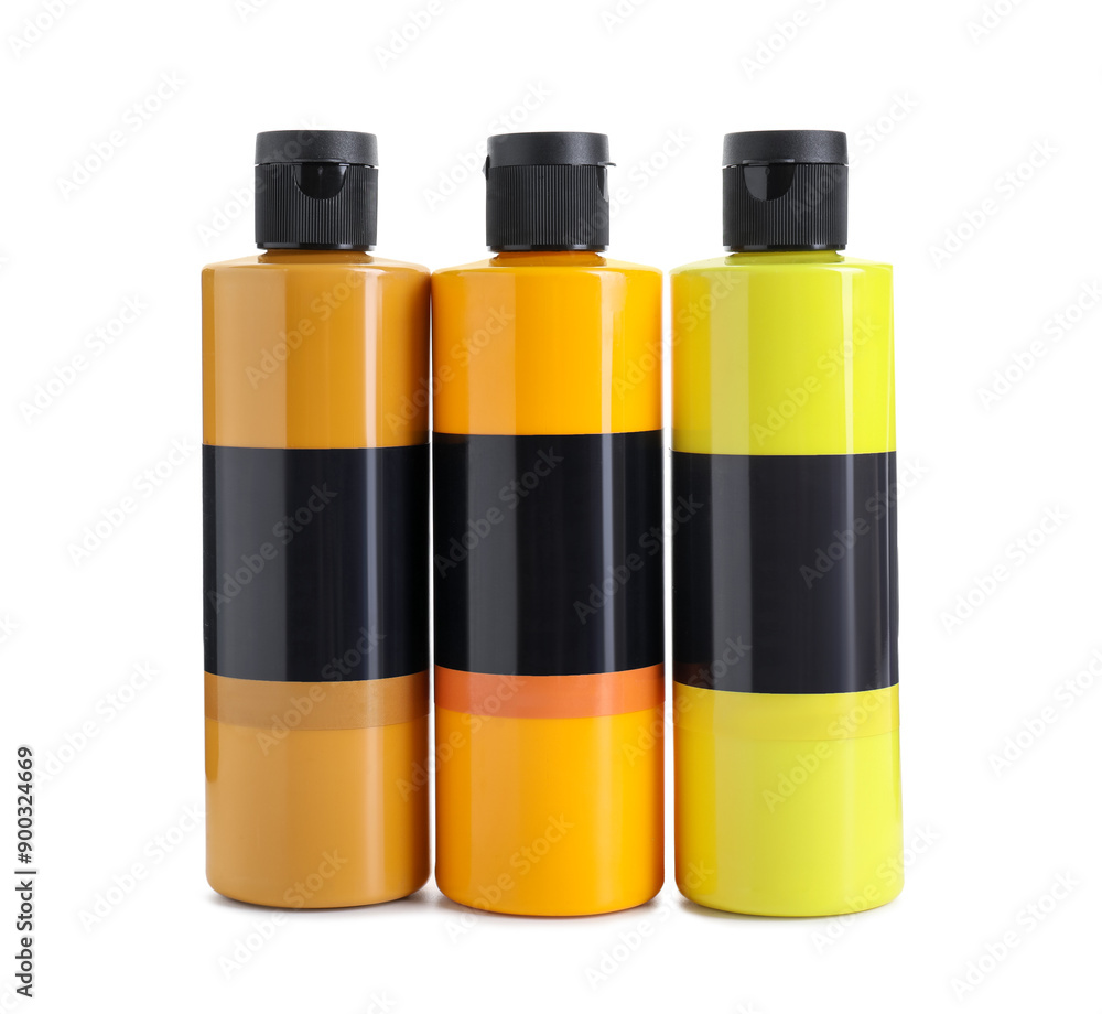 Acrylic paints of different colors in bottles isolated on white Acrylic paints of different colors in bottles isolated on white