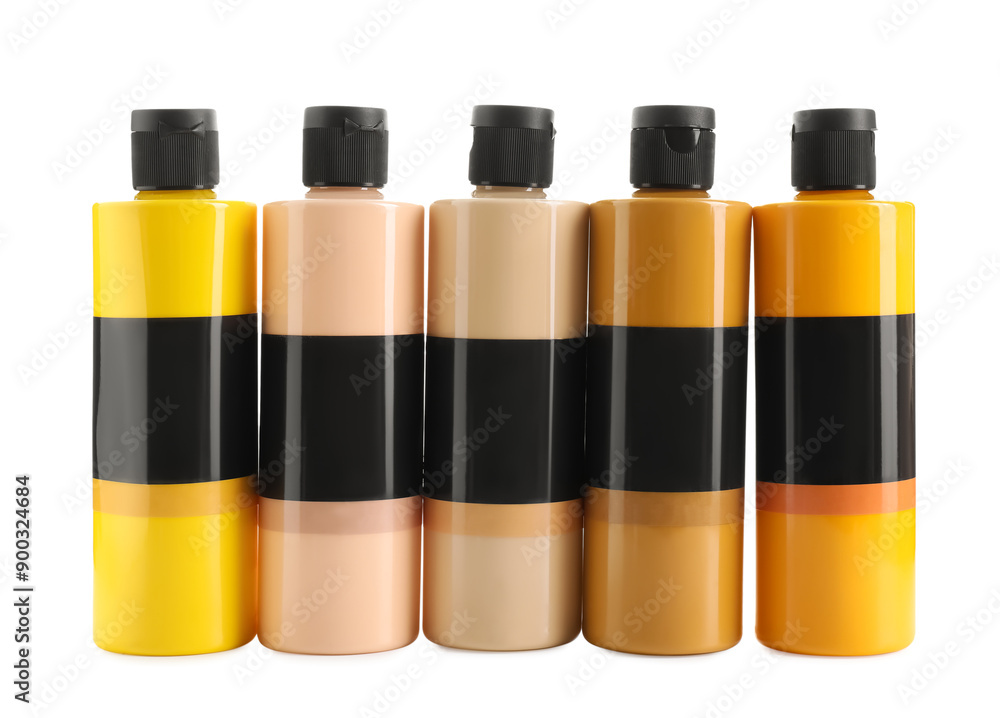 Acrylic paints of different colors in bottles isolated on white Acrylic paints of different colors in bottles isolated on white