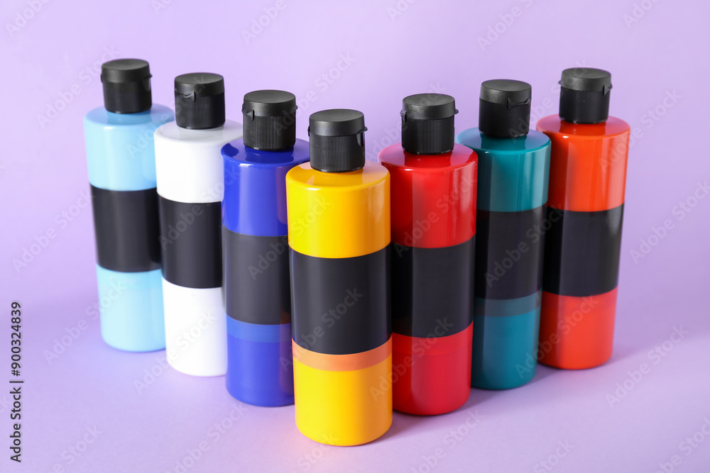 Acrylic paints of different colors on violet background Acrylic paints of different colors on violet background