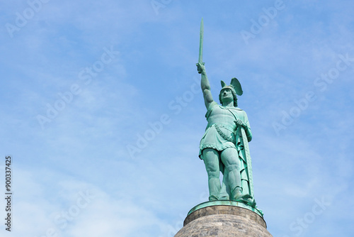 close-up Hermannsdenkmal in Gemany, a memorial for cherusci war chief Arminius or Hermann in German, against blue sky with copy space photo