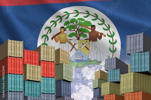 Belize flag and big stack of shipping cargo containers in docks with sky background close up photo