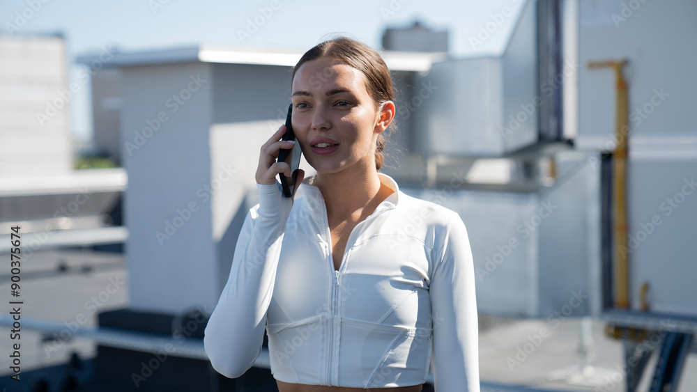 Young pretty sport woman using mobile phone at outdoors with happy expression Young pretty sport woman using mobile phone at outdoors with happy expression