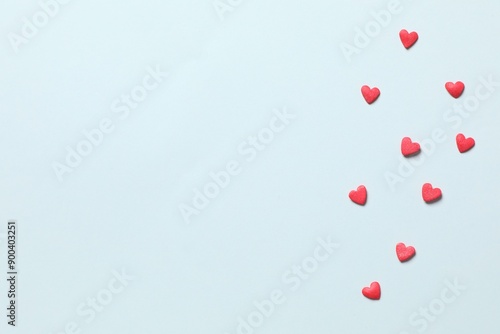 Red hearts on a colored background 