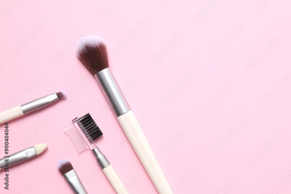 Cosmetic brushes on colored background. Set of makeup brushes Cosmetic brushes on colored background. Set of makeup brushes