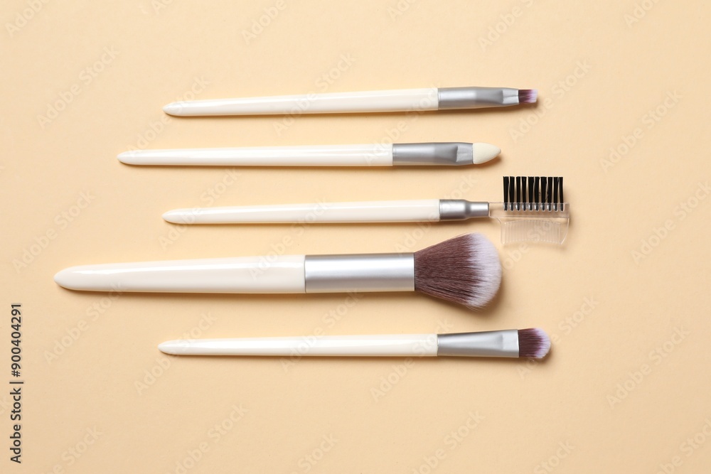 Cosmetic brushes on colored background. Set of makeup brushes Cosmetic brushes on colored background. Set of makeup brushes