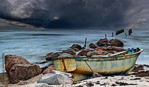 Just before rare summer storm in Baltic Sea, selective focus on old fishing b...