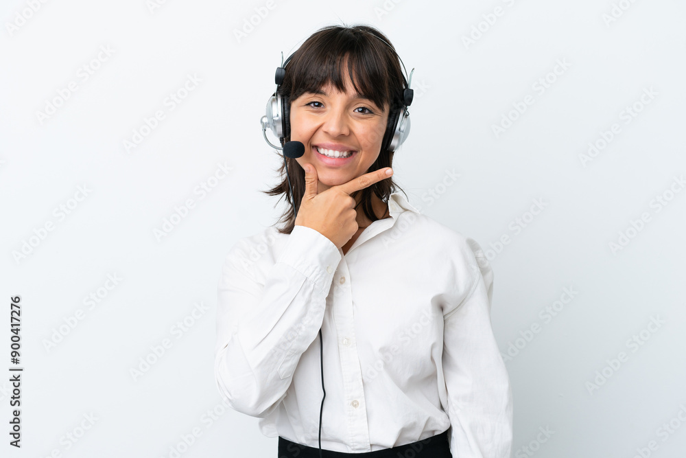 Telemarketer mixed race woman working with a headset isolated on white background smiling Telemarketer mixed race woman working with a headset isolated on white background smiling