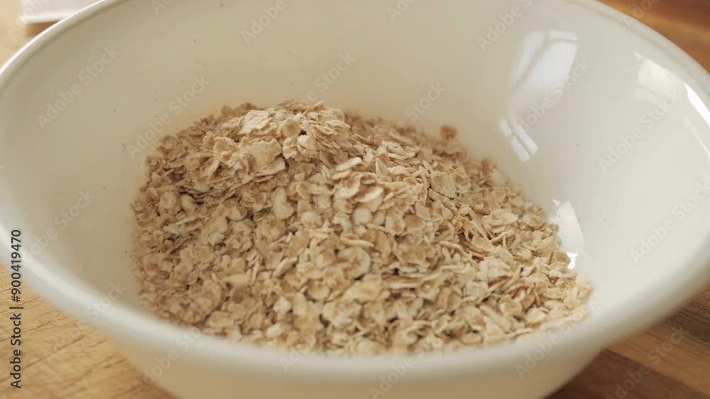 Detailed 4K UHD Video of Pouring Oats into a Small Bowl for Measuring | Close View
Detailed 4K UHD Video of Pouring Oats into a Small Bowl for Measuring | Close View