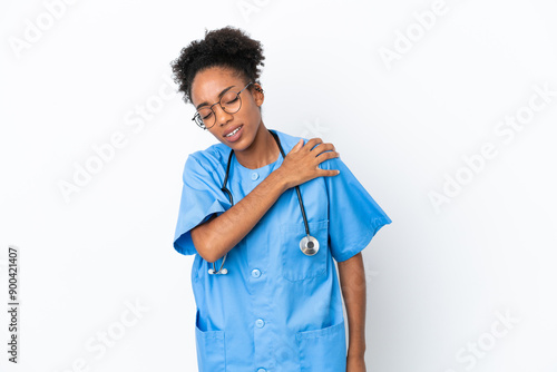 Young surgeon African American doctor woman isolated on white background suffering from pain in shoulder for having made an effort photo