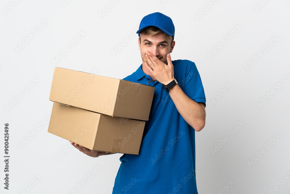 Young delivery blonde man isolated on white background happy and smiling covering mouth with hand Young delivery blonde man isolated on white background happy and smiling covering mouth with hand