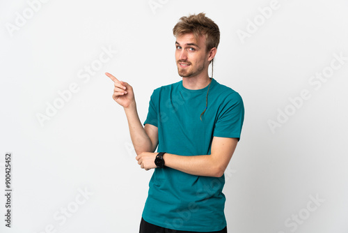 Young handsome man isolated on white background pointing finger to the side