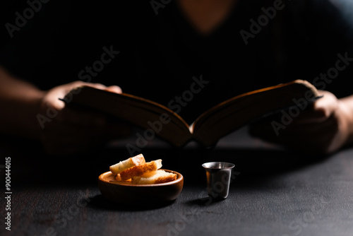 Sacred ceremony of Communion, Christians express their faith by partaking in holy bread, deepening their spiritual connection with God within the church. communion, religion, christian, faith, holy. photo