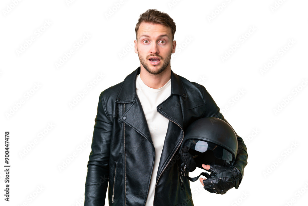 Young caucasian man with a motorcycle helmet over isolated chroma key background with surprise facial expression Young caucasian man with a motorcycle helmet over isolated chroma key background with surprise facial expression