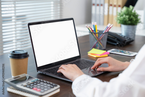 Woman hand using laptop and type on the keyboard, Mockup screen of advertisement.