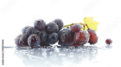 A bunch of ripe juicy purple grapes with water drops on white background. photo