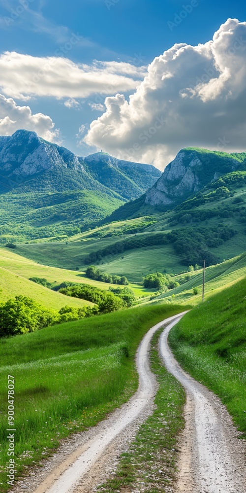 A winding road in the middle of a lush green valley with mountains in the background. The road is surrounded by trees and grass, creating a peaceful and serene atmosphere A winding road in the middle of a lush green valley with mountains in the background. The road is surrounded by trees and grass, creating a peaceful and serene atmosphere