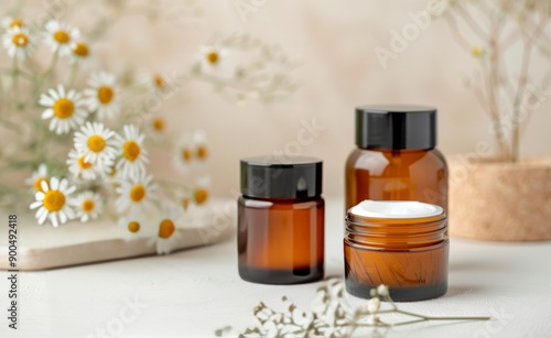 Chamomile Essential Oil Bottles on Wooden Coaster