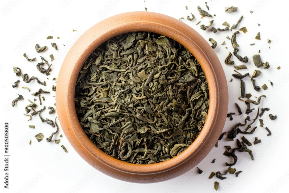 A bowl filled with green tea leaves A bowl filled with green tea leaves