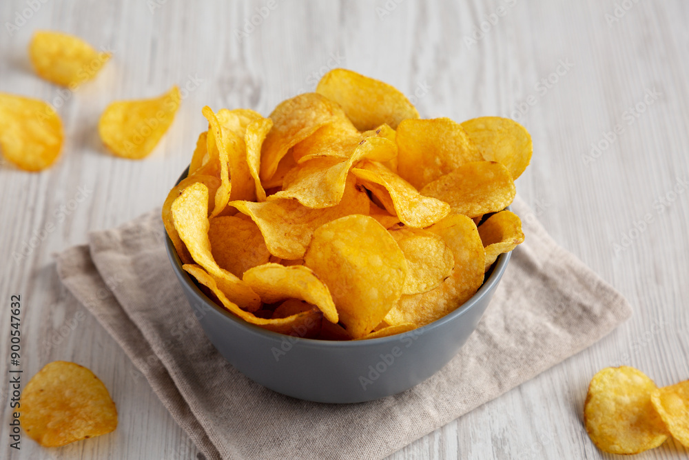 Bacon Flavored Potato Chips in a Bowl, side view. Close-up. Bacon Flavored Potato Chips in a Bowl, side view. Close-up.
