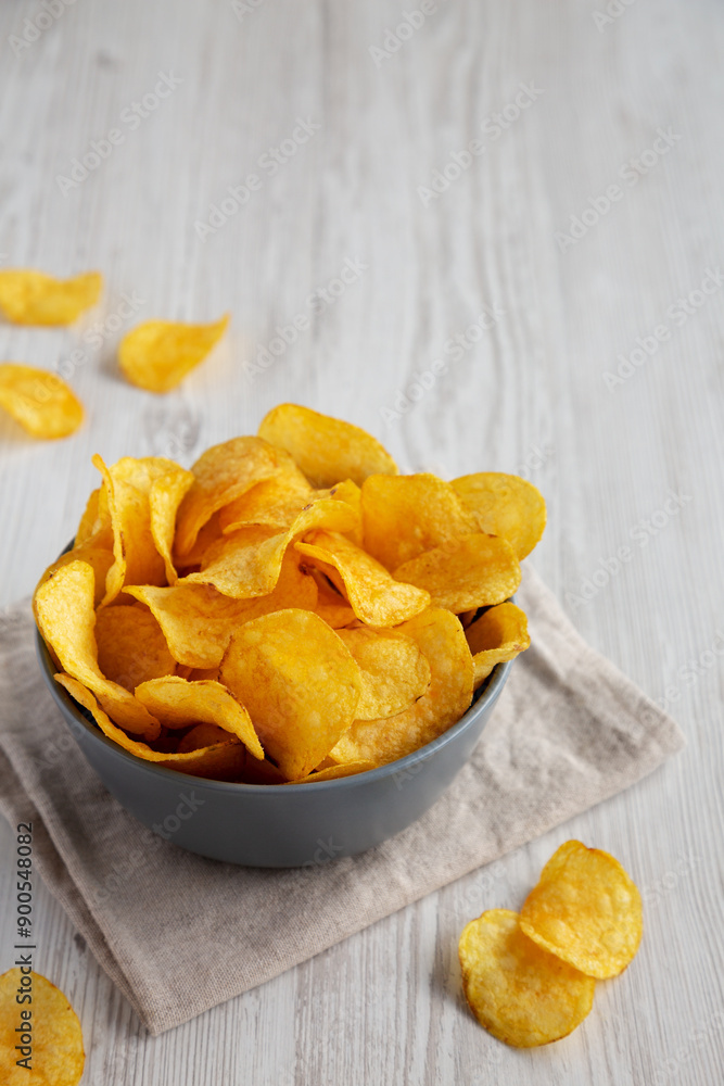 Bacon Flavored Potato Chips in a Bowl, side view. Copy space. Bacon Flavored Potato Chips in a Bowl, side view. Copy space.