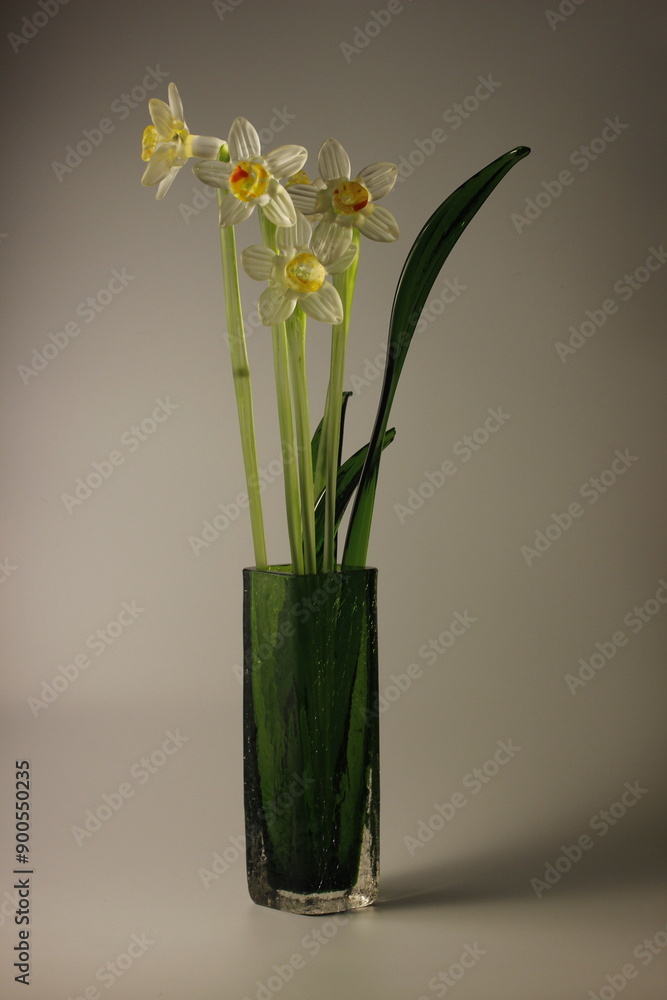 glass flowers in a glass vase. taken in close-up on a white background with space for text glass flowers in a glass vase. taken in close-up on a white background with space for text