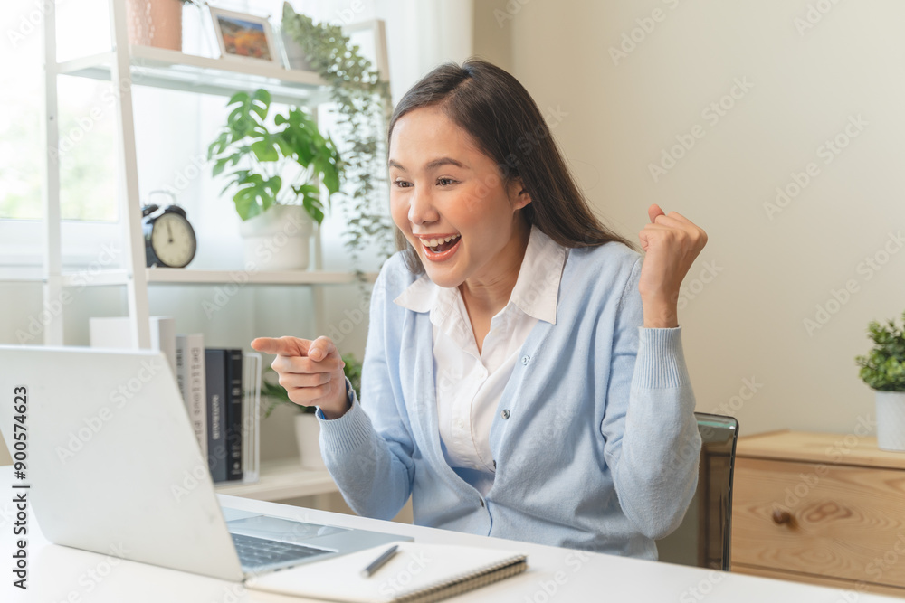 Good news reaction concept, Young adult females reading emails and have joyful expressions after receiving an offer of a job promotion from the company. Good news reaction concept, Young adult females reading emails and have joyful expressions after receiving an offer of a job promotion from the company.