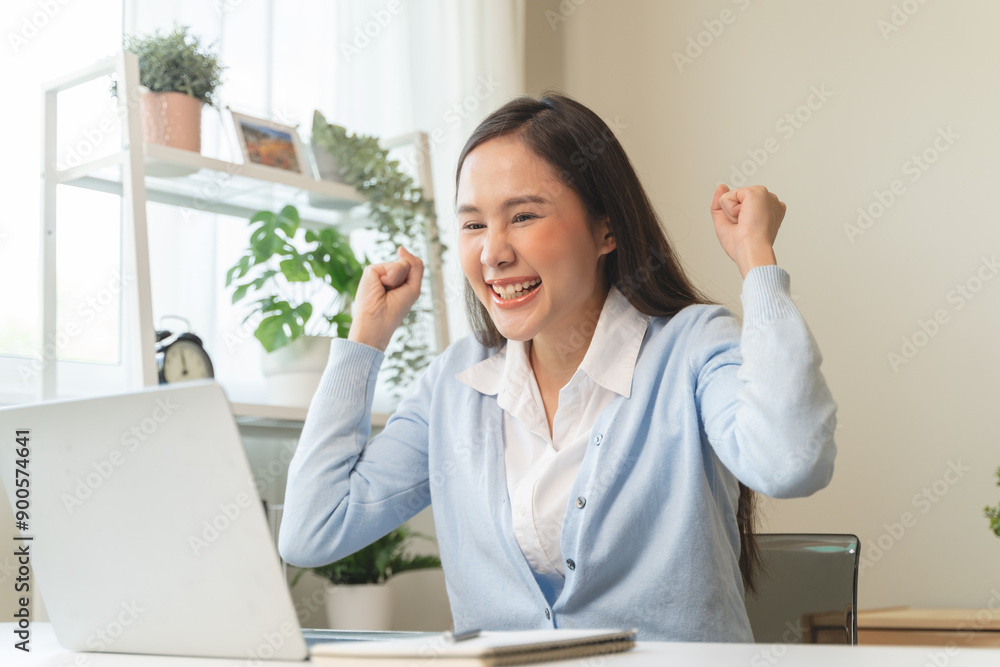 Good news reaction concept, Young adult females reading emails and have joyful expressions after receiving an offer of a job promotion from the company. Good news reaction concept, Young adult females reading emails and have joyful expressions after receiving an offer of a job promotion from the company.