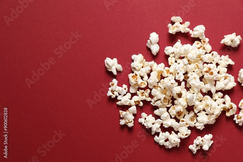 Delicious popcorn on a colored background