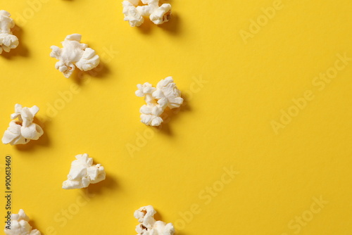 Delicious popcorn on a colored background