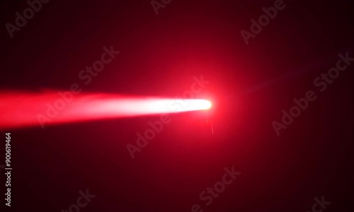 Crimson Beam Piercing the Void: A vibrant red laser cuts through a smoky black expanse, creating a dramatic interplay of light and shadow