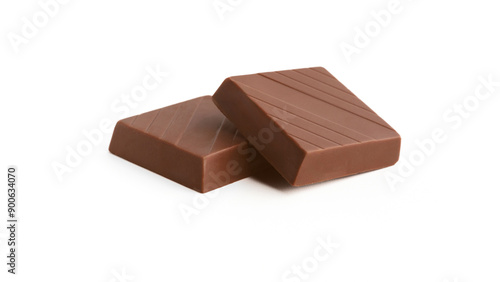 Milk chocolate pieces on a white background